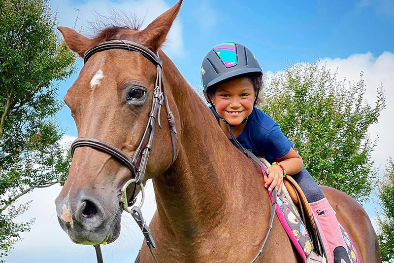 Kid on horse at kays acres